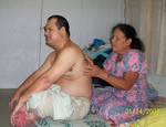 Ketia Scott massaging Maxmillian Brechtefeld